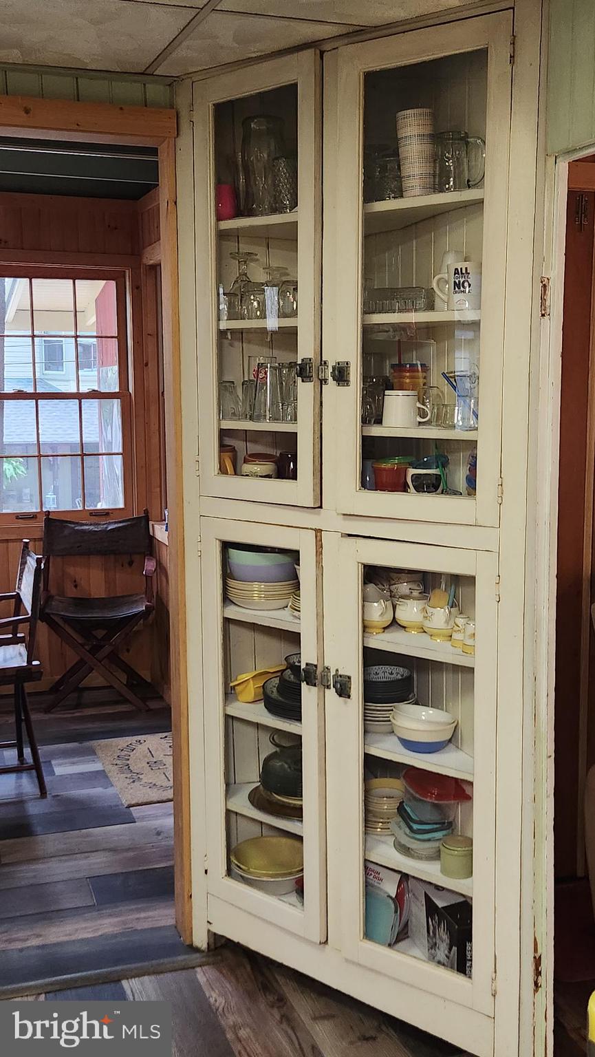 403 Boehm Avenue Mount Gretna, PA 17064 - Photo 14 of 14 a living room with a wooden floor and a cabinet