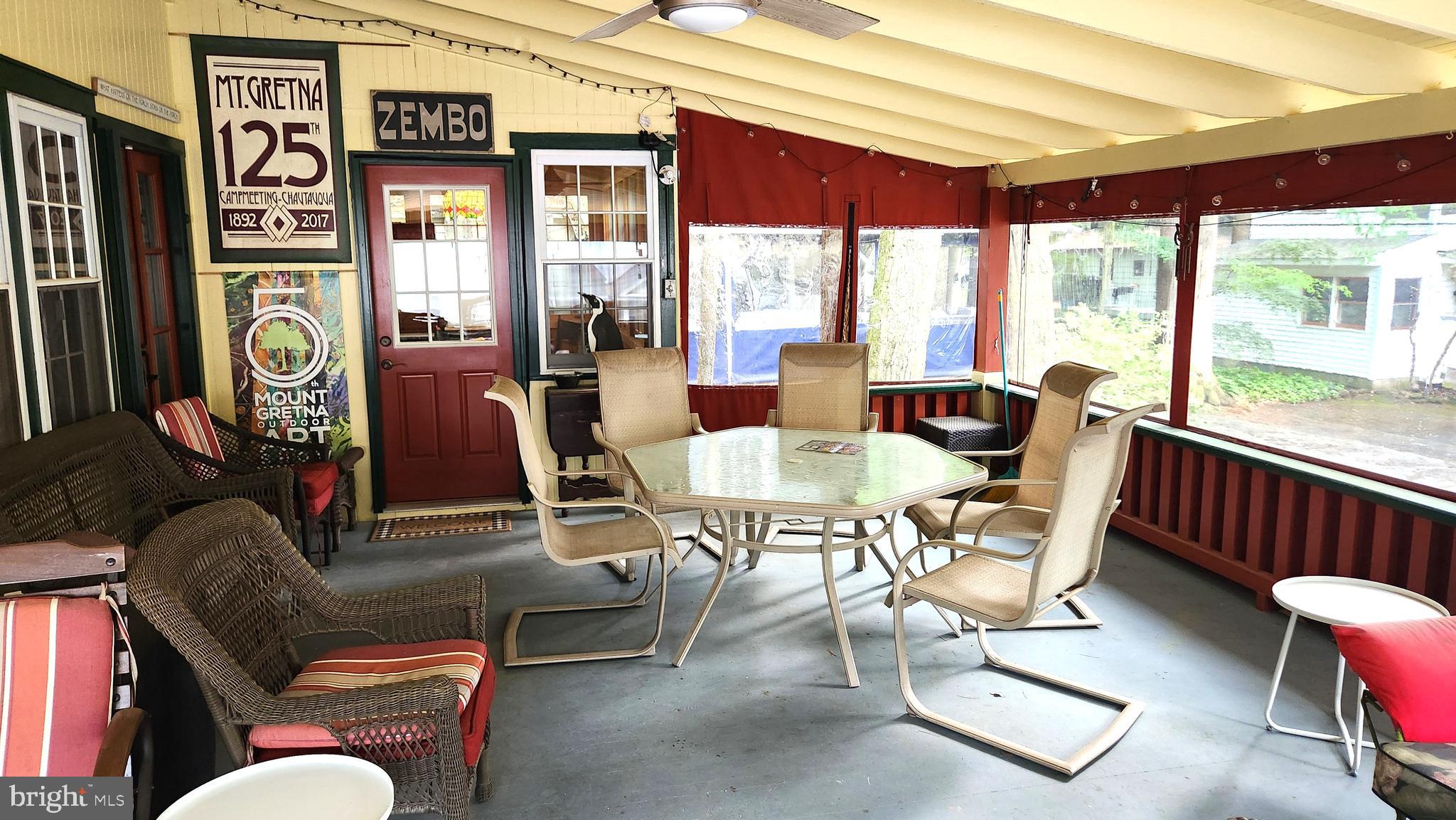 403 Boehm Avenue Mount Gretna, PA 17064 - Photo 6 of 14 a living room with furniture and floor to ceiling windows