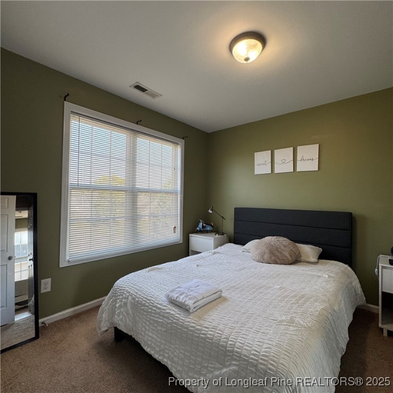 2020 Gray Goose Loop Fayetteville, NC 28306 - Photo 26 of 28 a bedroom with a bed and a window