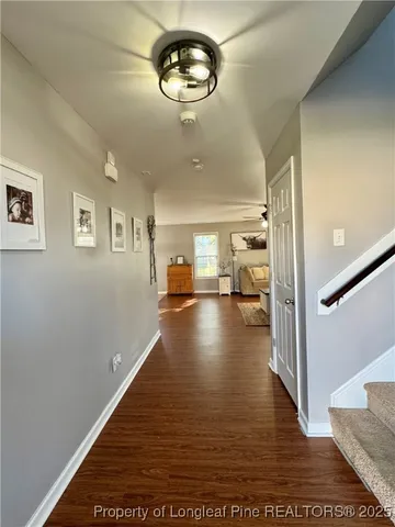 a view of livingroom and dining room with wooden floor