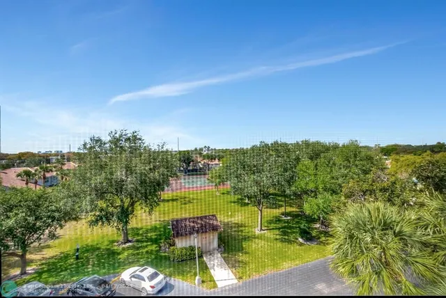 a swimming pool with outdoor seating and yard