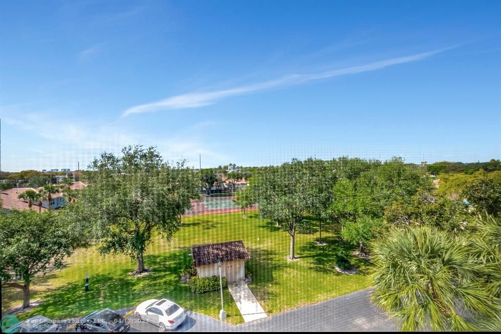 5260 Northwest 2nd Avenue, Unit 504 Boca Raton, FL 33487 - Photo 11 of 23 a swimming pool with outdoor seating and yard