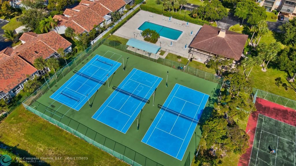 5260 Northwest 2nd Avenue, Unit 504 Boca Raton, FL 33487 - Photo 13 of 23 an aerial view of a house with a yard
