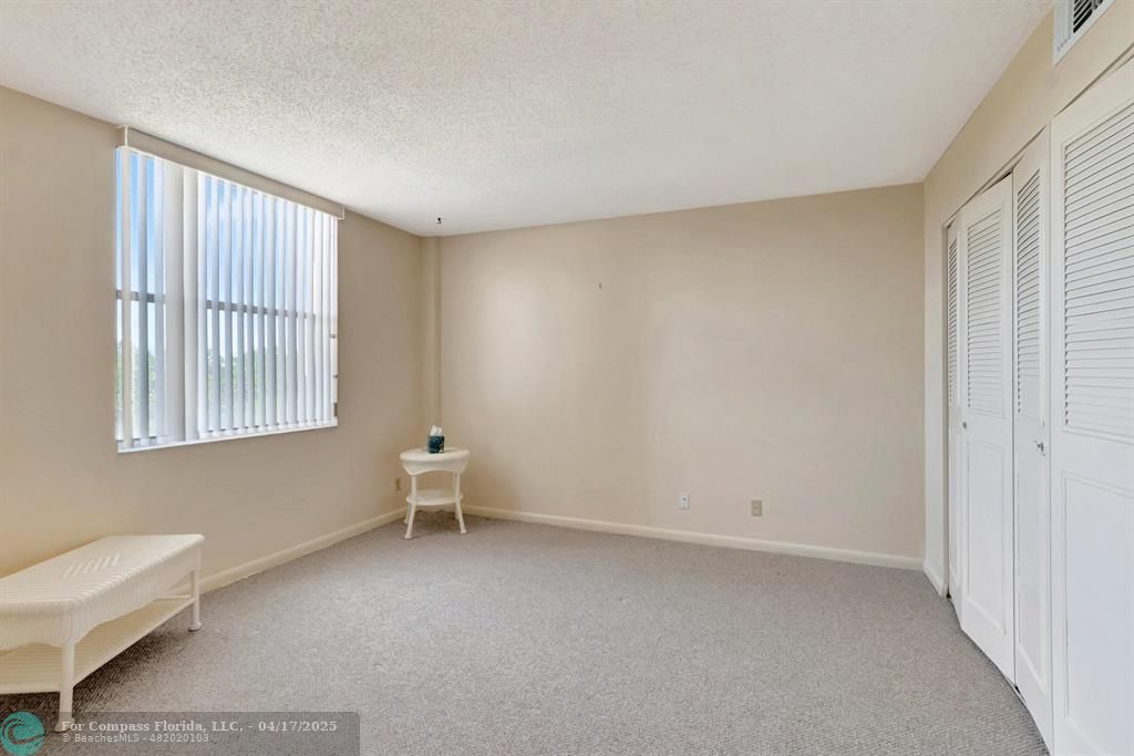 5260 Northwest 2nd Avenue, Unit 504 Boca Raton, FL 33487 - Photo 18 of 23 an empty room with a window