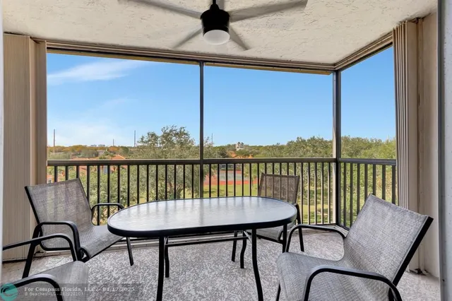 a balcony view with a seating space