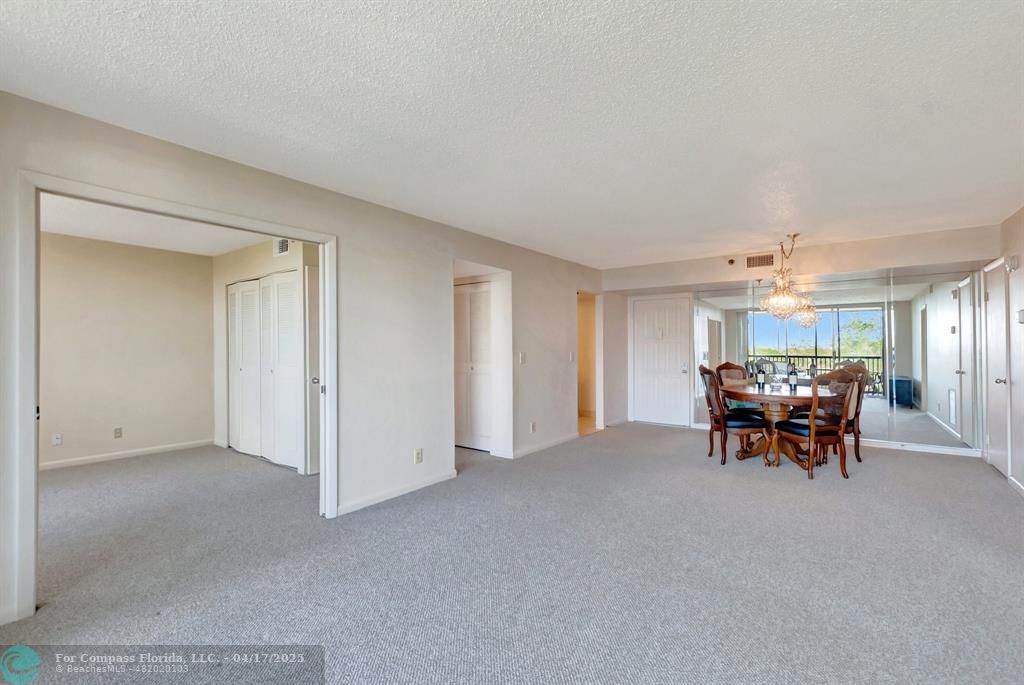 5260 Northwest 2nd Avenue, Unit 504 Boca Raton, FL 33487 - Photo 4 of 23 a view of a livingroom with furniture and chandelier