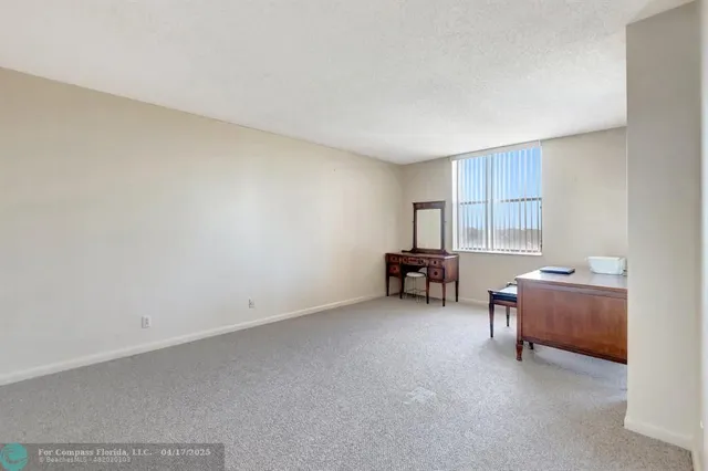 a room with furniture and air conditioner vent