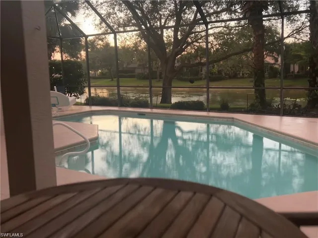 a view of a lake with houses in the background