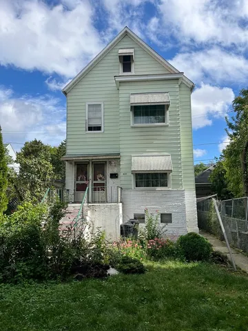 a front view of house with a yard