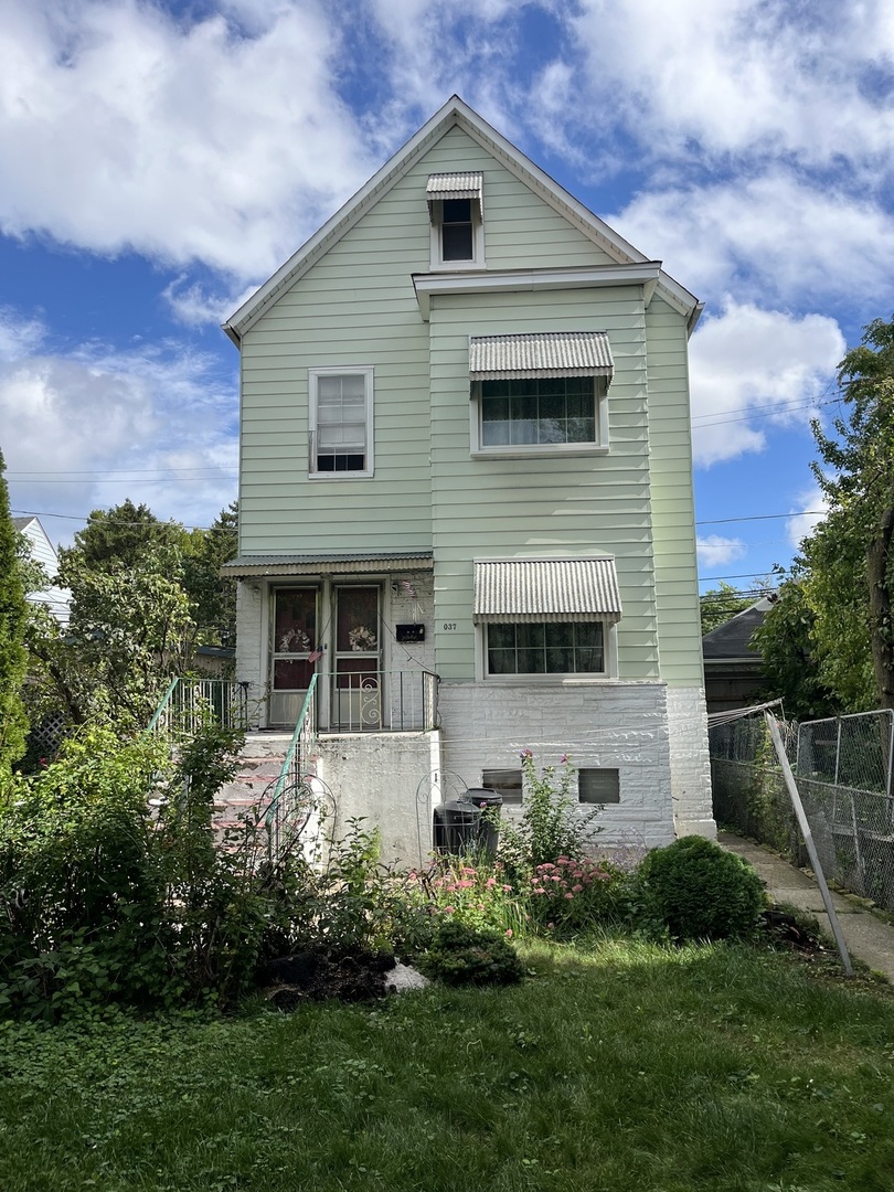 a front view of house with a yard