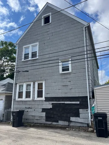 a front view of a house with stairs