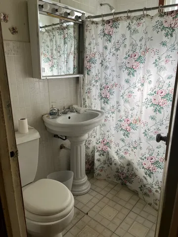 a kitchen with a sink window and cabinets