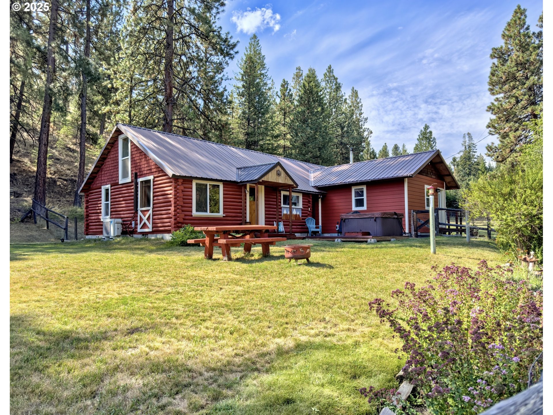 a front view of a house with swimming pool having outdoor seating