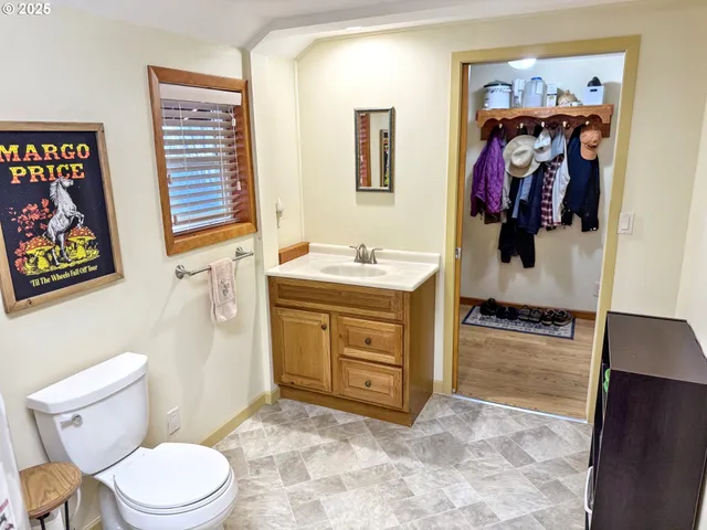 a reading room with furniture a rug and a book shelf