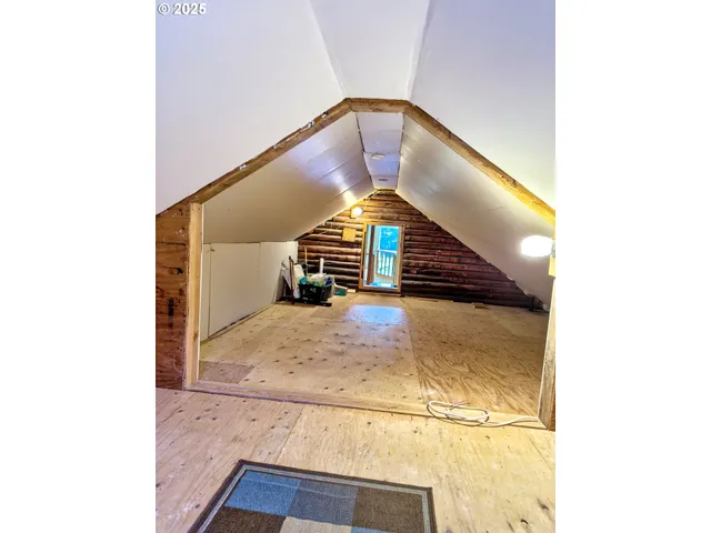 a kitchen that has a table and chairs in it