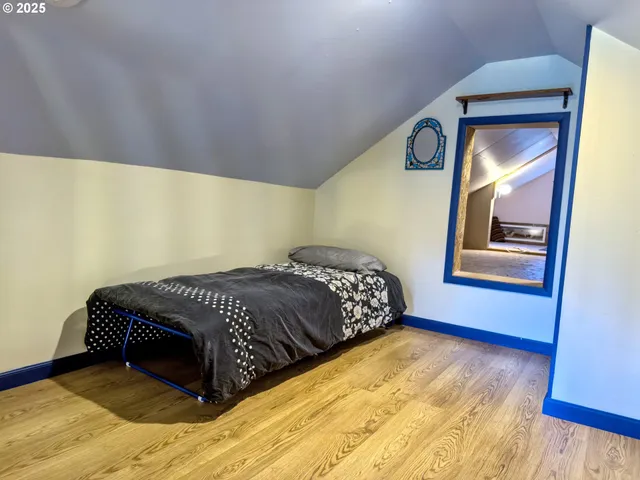 a bed room with a bed and a window