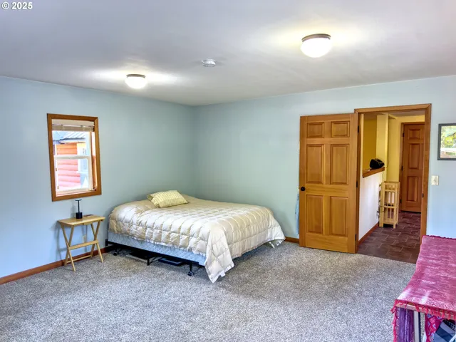 a view of a big yard with lots of green space and plants