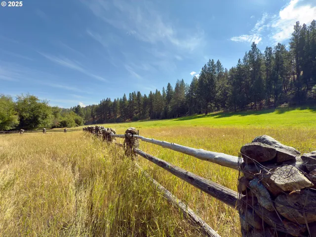 a wooden bench sitting in the middle of a snow