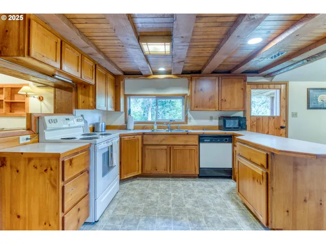 a view of a lush green hillside and a building