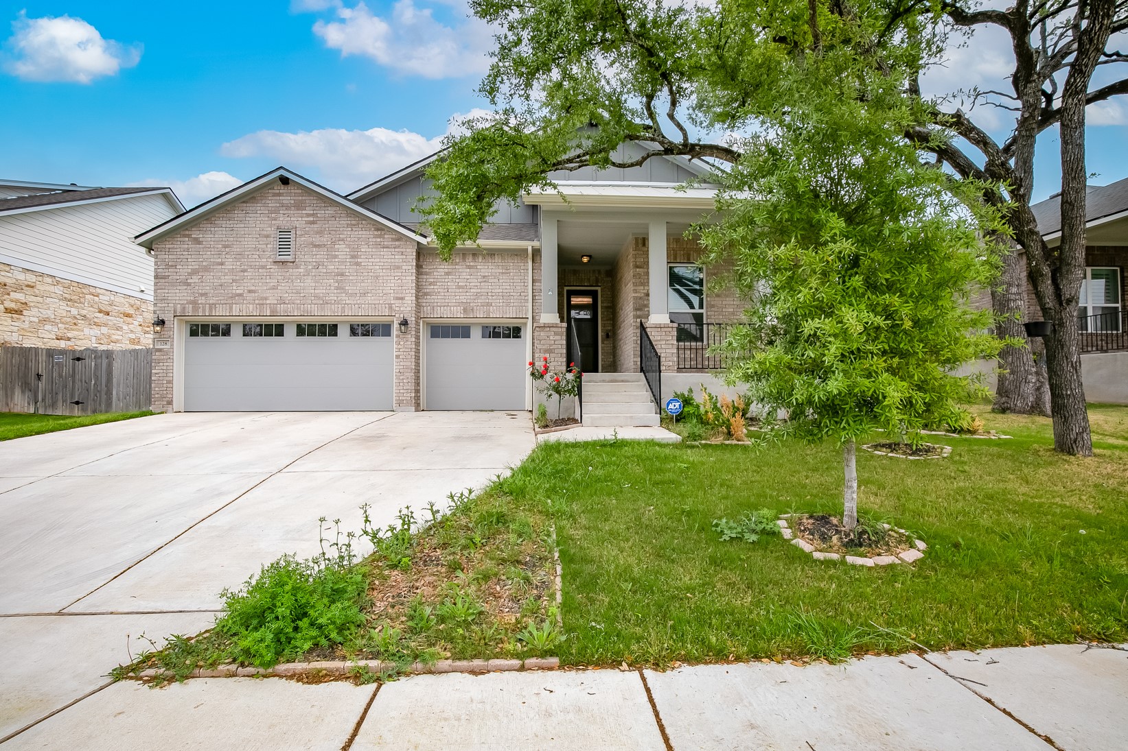 128 Ridgeview Court Georgetown, TX 78628 - Photo 1 of 22 a front view of a house with a garden and plants