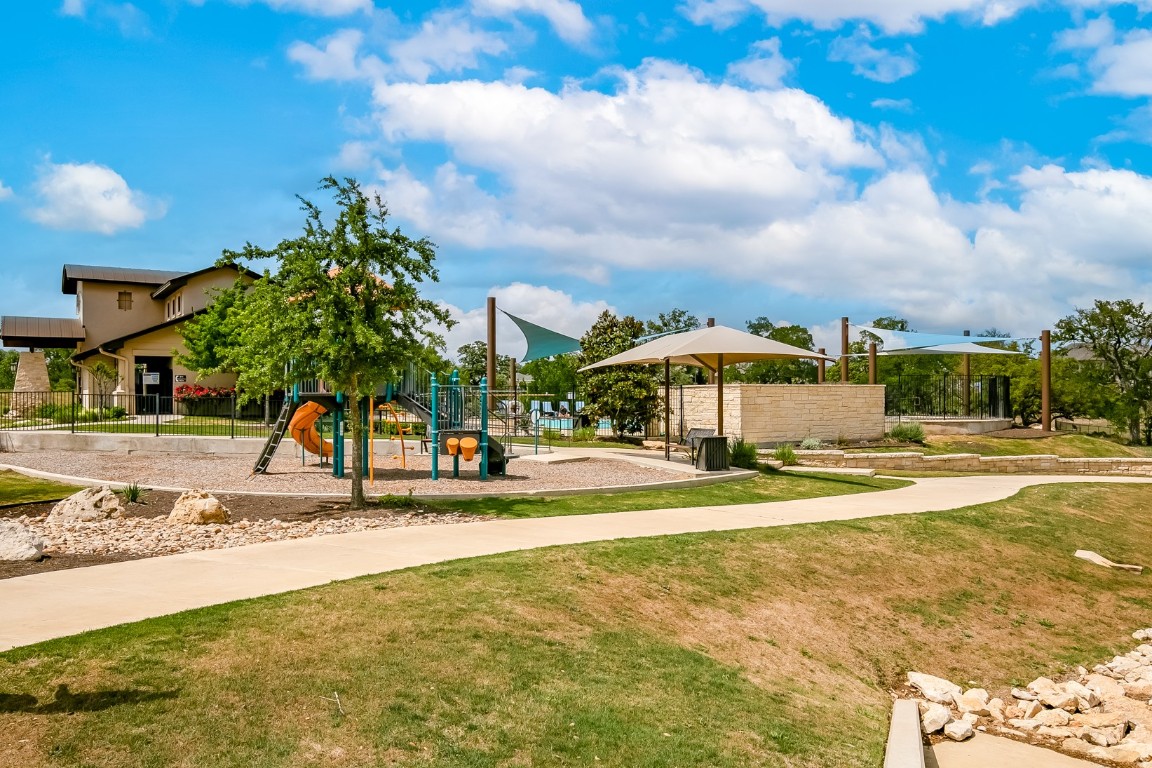 128 Ridgeview Court Georgetown, TX 78628 - Photo 20 of 22 a view of a swimming pool with an outdoor space and seating area