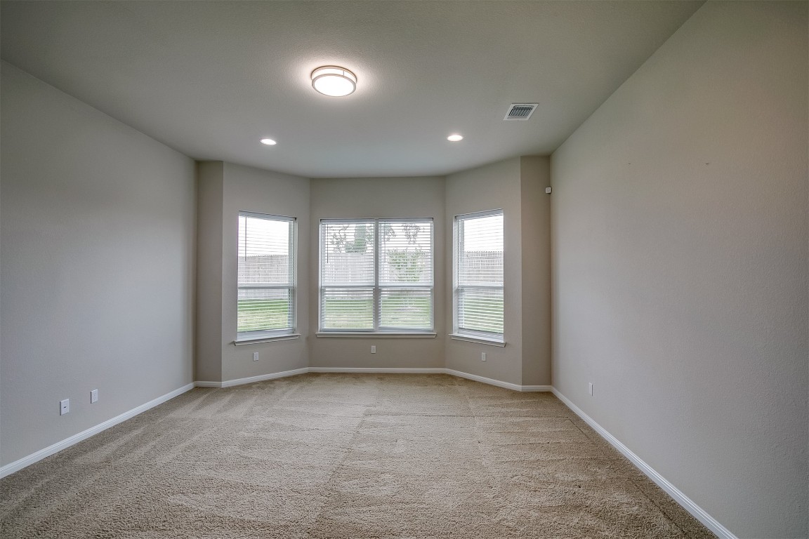 128 Ridgeview Court Georgetown, TX 78628 - Photo 9 of 22 an empty room with large windows