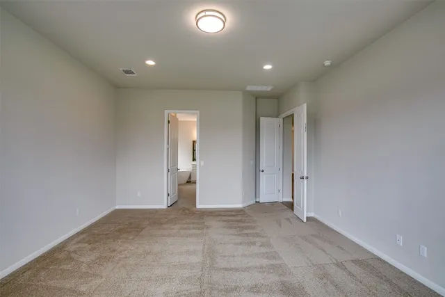 a bathroom with a tub a sink and mirror