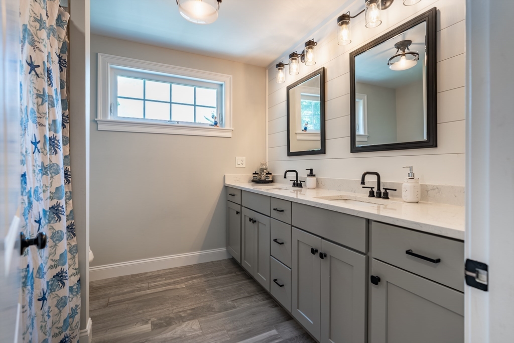 24 Coury Drive Acushnet, MA 02743 - Photo 15 of 42 a bathroom with a double vanity sink mirror and