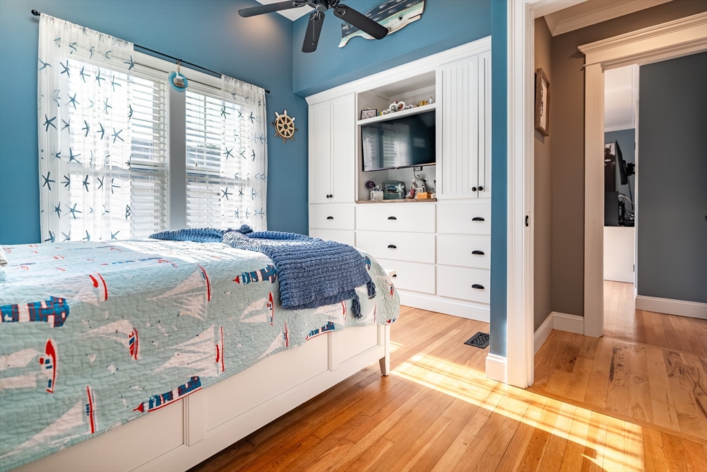 24 Coury Drive Acushnet, MA 02743 - Photo 18 of 42 a bedroom with a bed and a flat tv screen on dresser