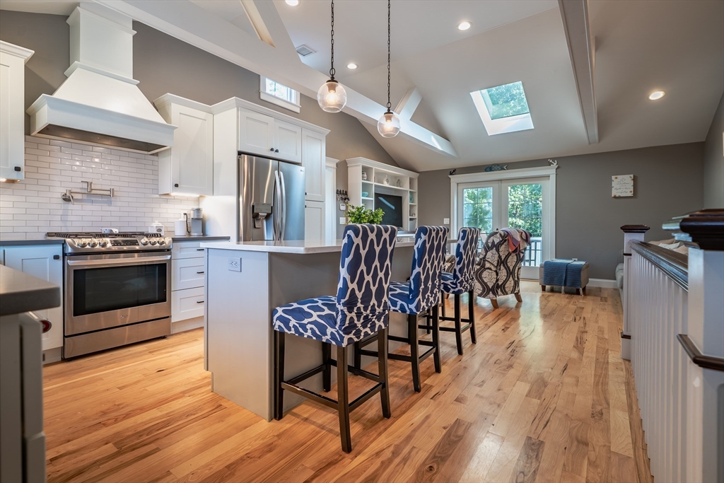 24 Coury Drive Acushnet, MA 02743 - Photo 4 of 42 a view of a dining room with furniture and wooden floor