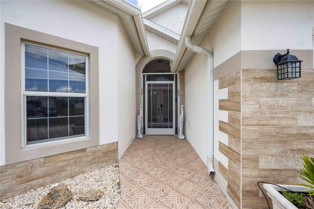 48 Bunker Road Rotonda West, FL 33947 - Photo 8 of 59 a view of front door of a house