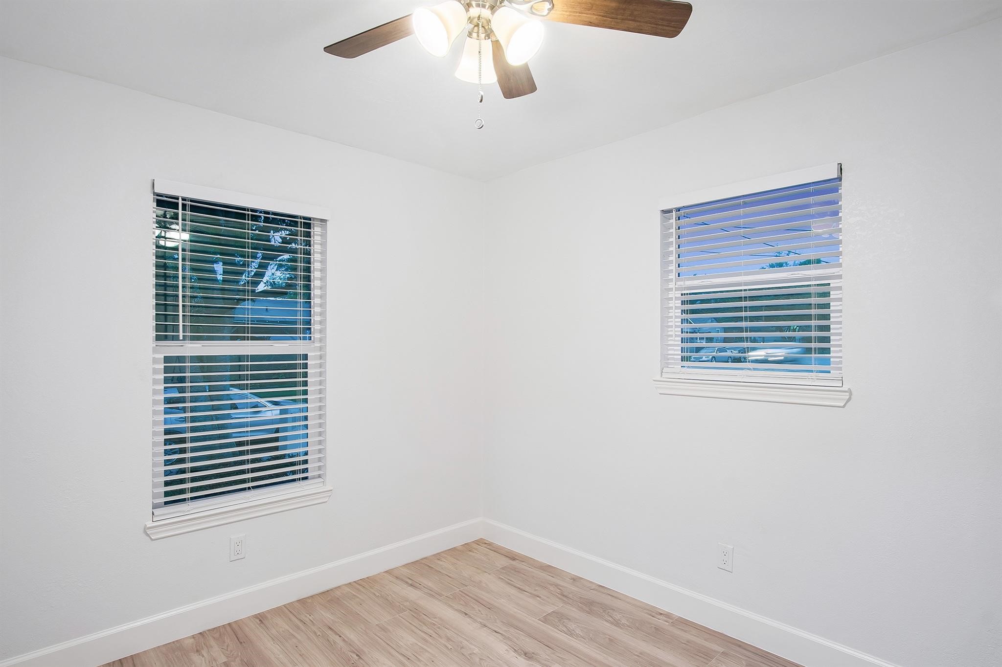 4808 Terry Street Houston, TX 77009 - Photo 15 of 21 a view of an empty room with wooden floor and a window
