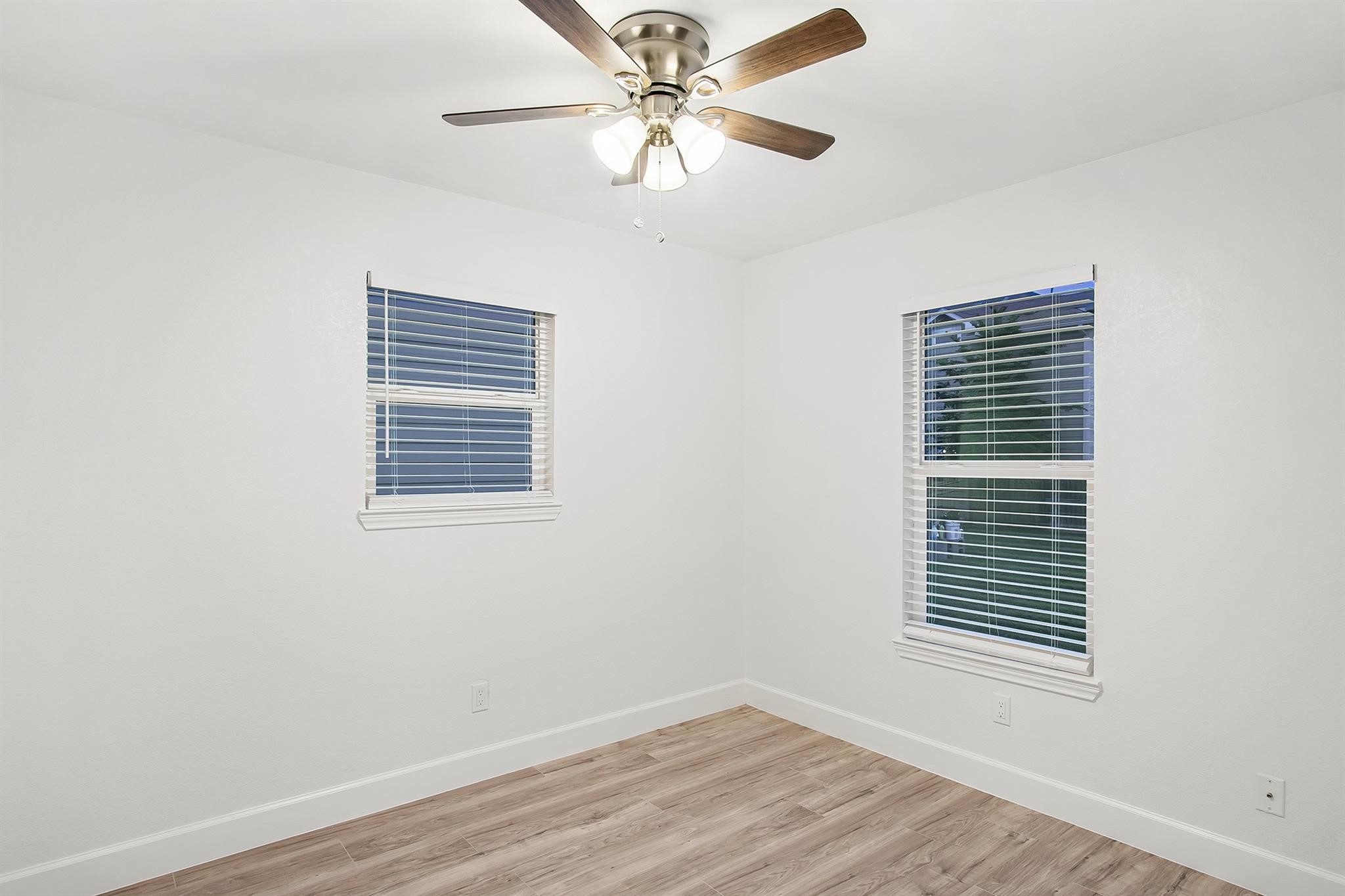 4808 Terry Street Houston, TX 77009 - Photo 19 of 21 a view of a room with a ceiling fan and a window