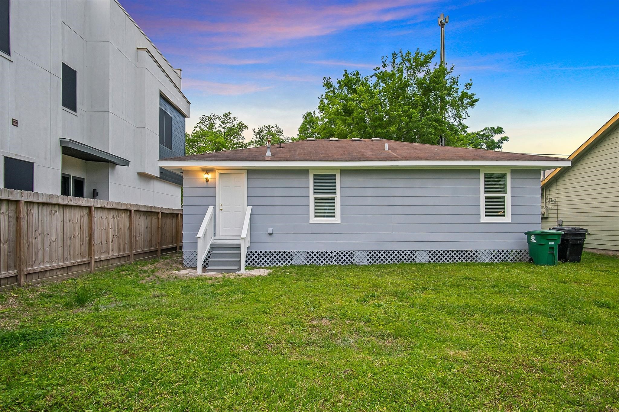 4808 Terry Street Houston, TX 77009 - Photo 20 of 21 a front view of a house with a yard and trees