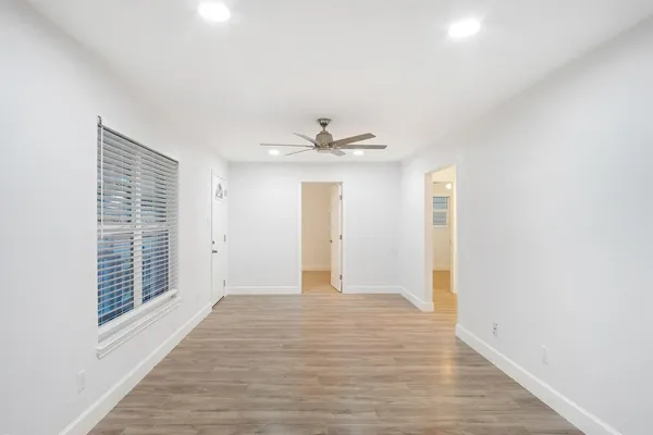 a view of an empty room with a window