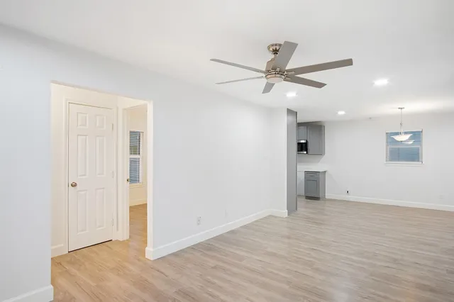a kitchen with kitchen island a sink stainless steel appliances and cabinets