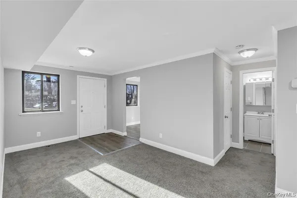 a view of an empty room with a window