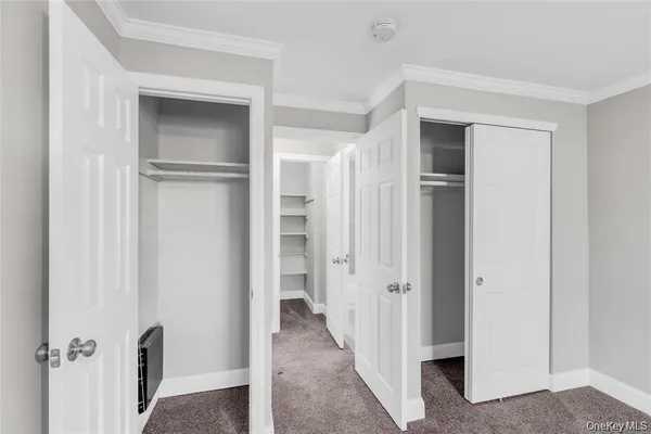 a view of an empty room and a window