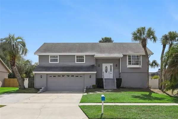 a view of house with a garden