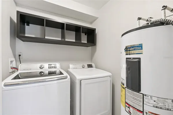 a front view of a house with a yard and palm tree
