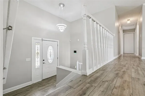 a view of entryway with stairs and wooden floor