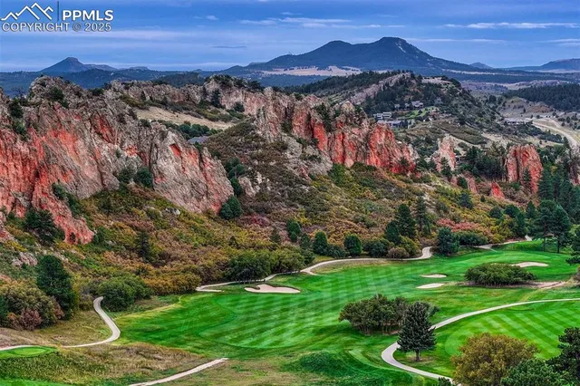 an aerial view of a house with a garden