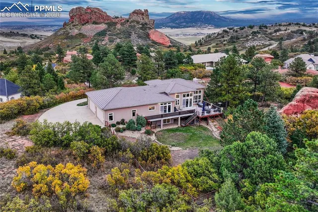 a kitchen that has a sink a stove and a refrigerator