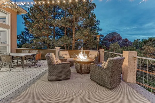 a swimming pool with outdoor seating and yard