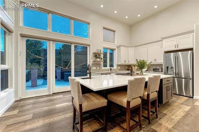 a workspace room with furniture and window