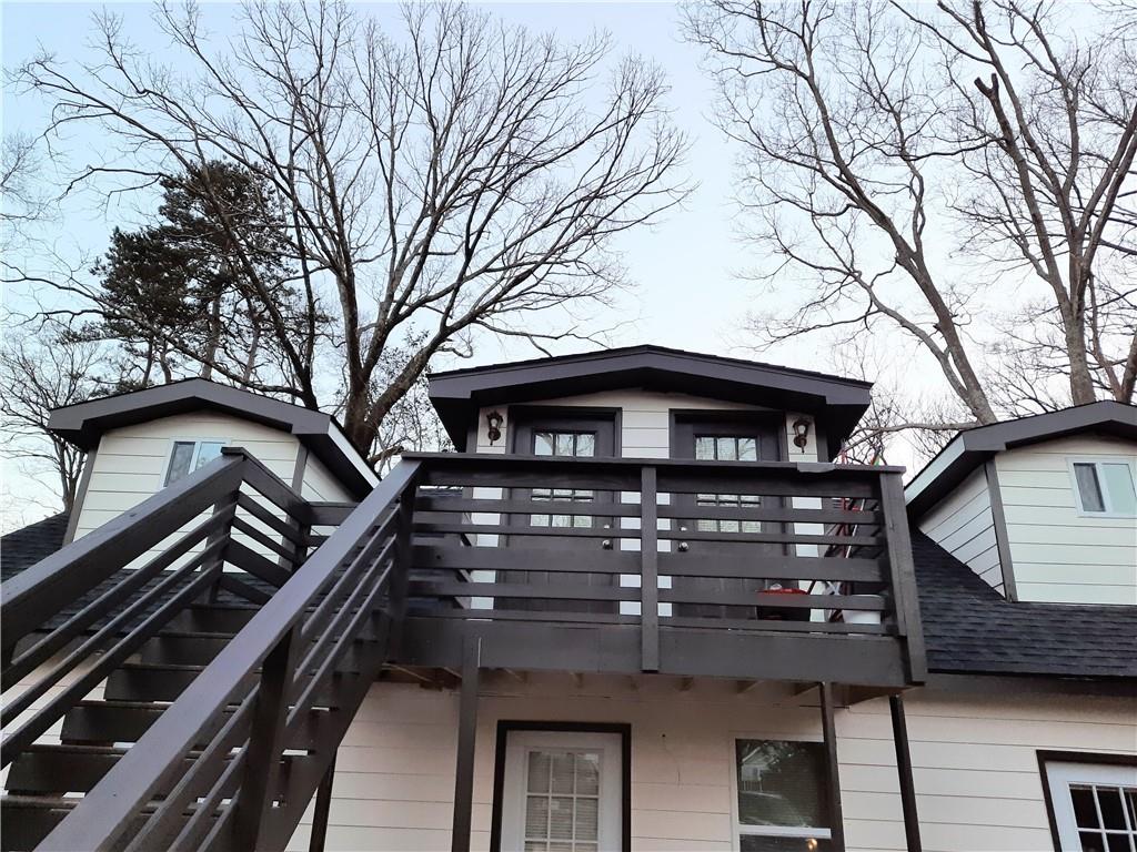 1470 St Michael Avenue, Unit 2 Atlanta, GA 30344 - Photo 1 of 23 a front view of a house with a tree