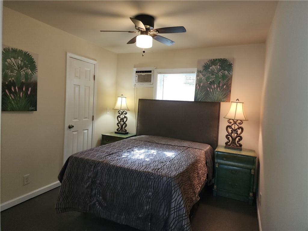 1470 St Michael Avenue, Unit 2 Atlanta, GA 30344 - Photo 19 of 23 a bed sitting in a bedroom next to a window