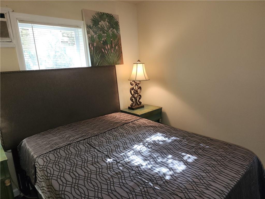 1470 St Michael Avenue, Unit 2 Atlanta, GA 30344 - Photo 21 of 23 a bedroom with a bed and a window