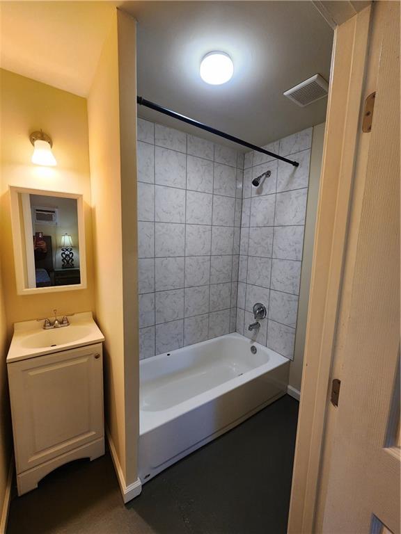 1470 St Michael Avenue, Unit 2 Atlanta, GA 30344 - Photo 10 of 23 a bathroom with a sink a toilet and shower