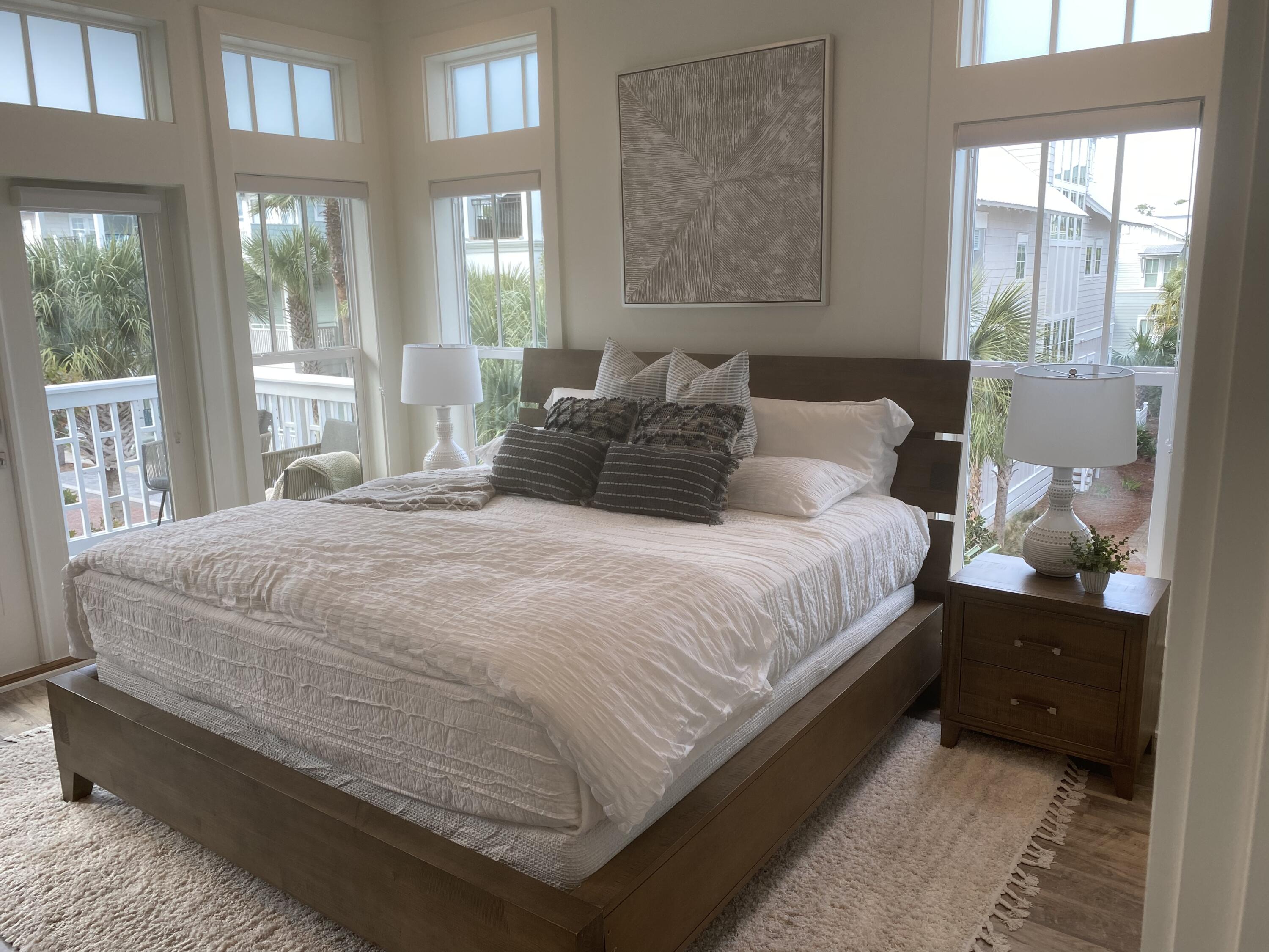 8 Lazy Day Ln Inlet Beach Inlet Beach, FL 32461 - Photo 11 of 13 a bedroom with a bed and glass window